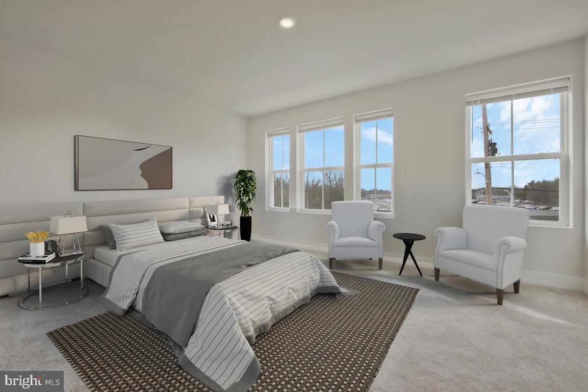 7268 Contee Road Laurel, MD 20707 - Photo 31 of 42 a bedroom with a bed a couch and a window