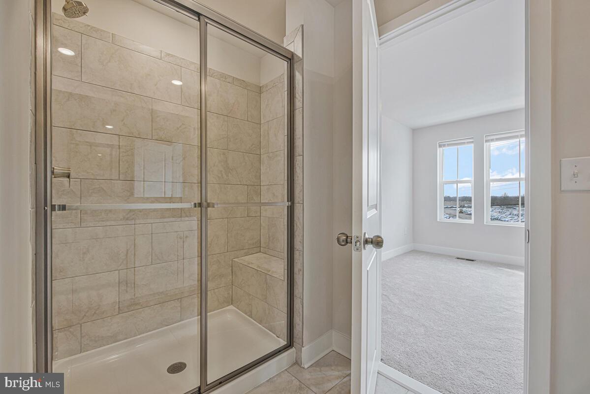 7268 Contee Road Laurel, MD 20707 - Photo 35 of 42 a bathroom with a glass shower door
