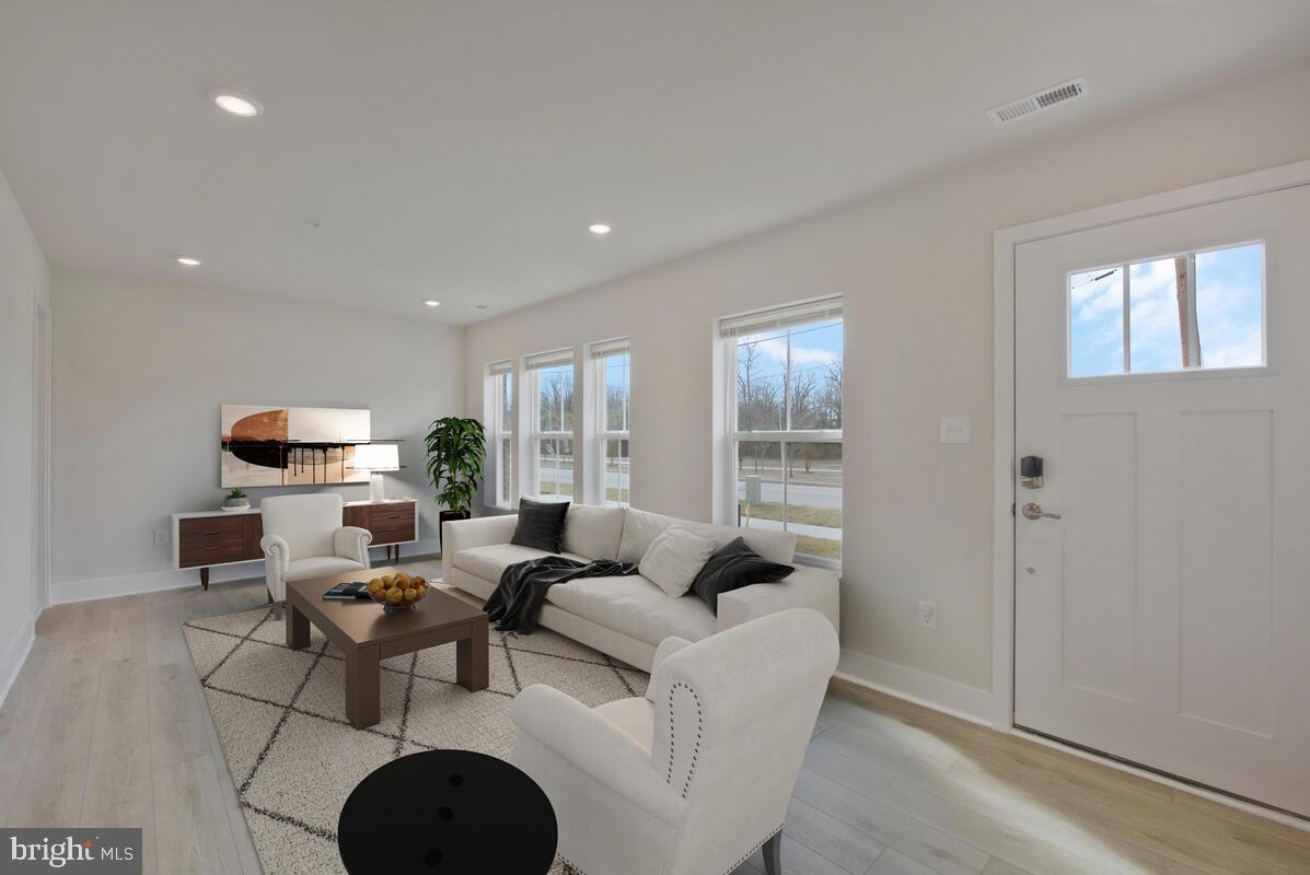 7268 Contee Road Laurel, MD 20707 - Photo 6 of 42 a living room with furniture and a large window