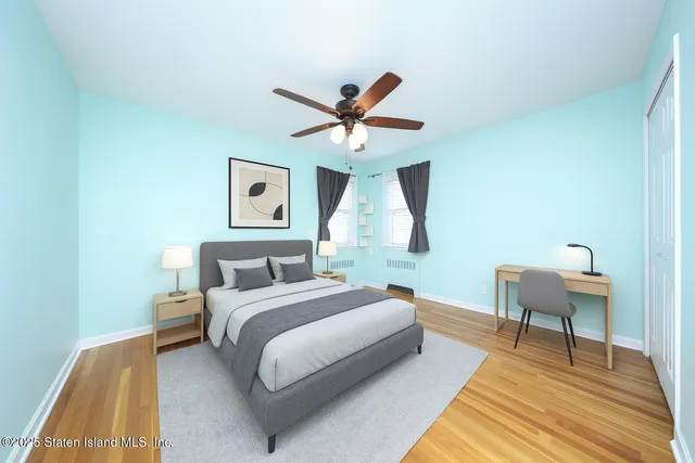 an aerial view of residential houses with open space and city view