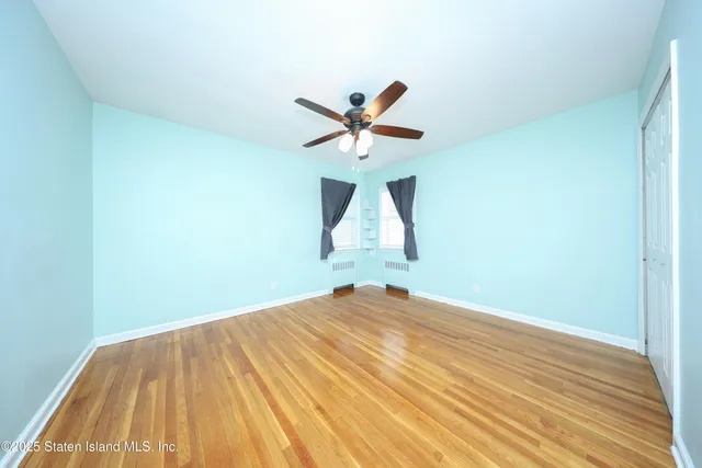 an aerial view of residential houses with outdoor space and parking