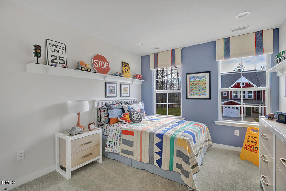 322 Short Ridge Way Rolesville, NC 27571 - Photo 12 of 22 a bedroom with bed and a window