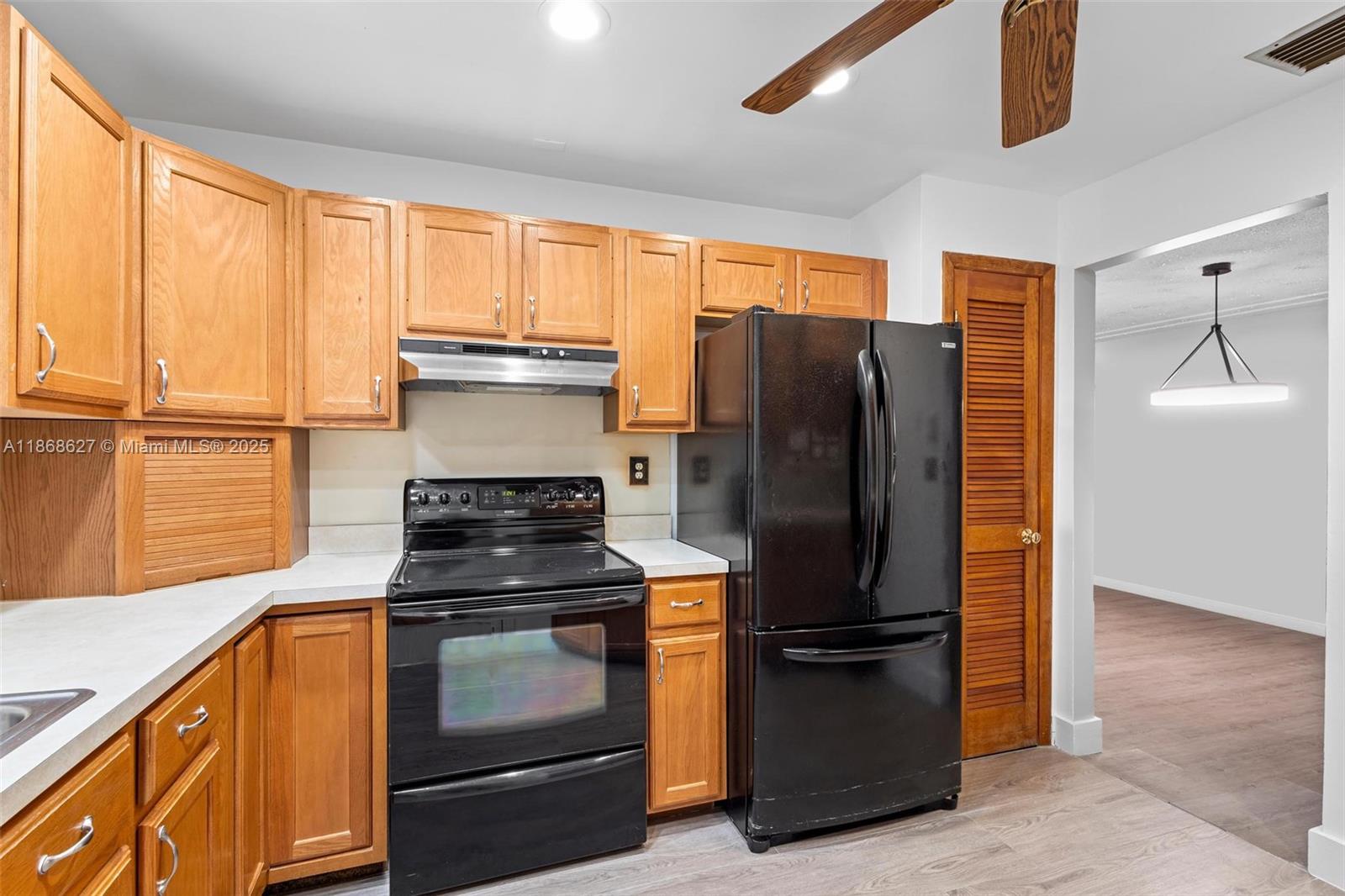 27661 Southwest 162nd Court Homestead, FL 33031 - Photo 23 of 60 a kitchen with appliances and a window