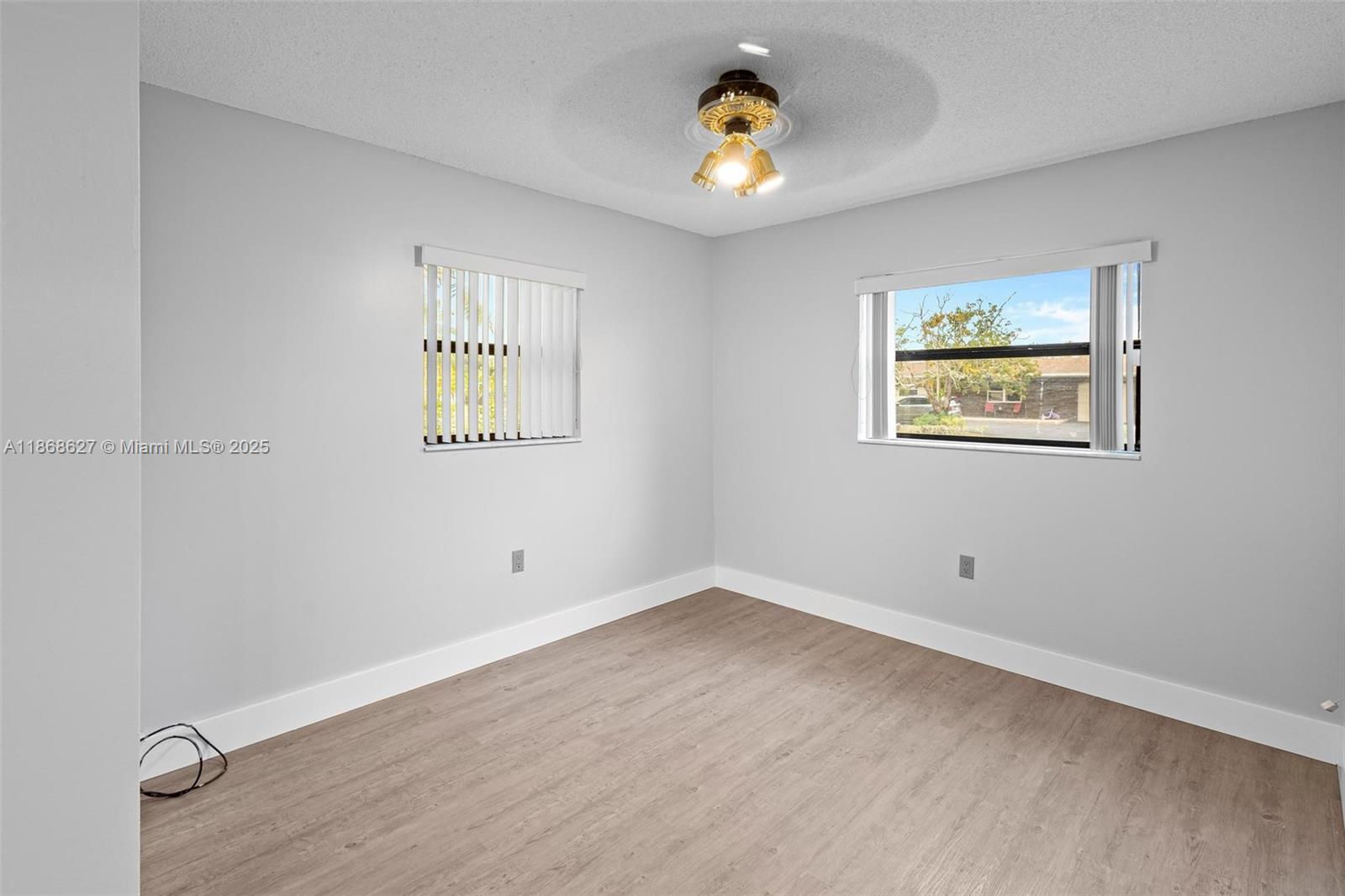 27661 Southwest 162nd Court Homestead, FL 33031 - Photo 32 of 60 an empty room with a painting on the wall