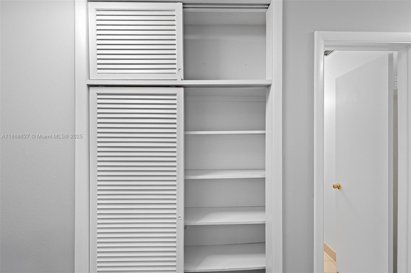 27661 Southwest 162nd Court Homestead, FL 33031 - Photo 37 of 60 a view of a room with rack on the wall