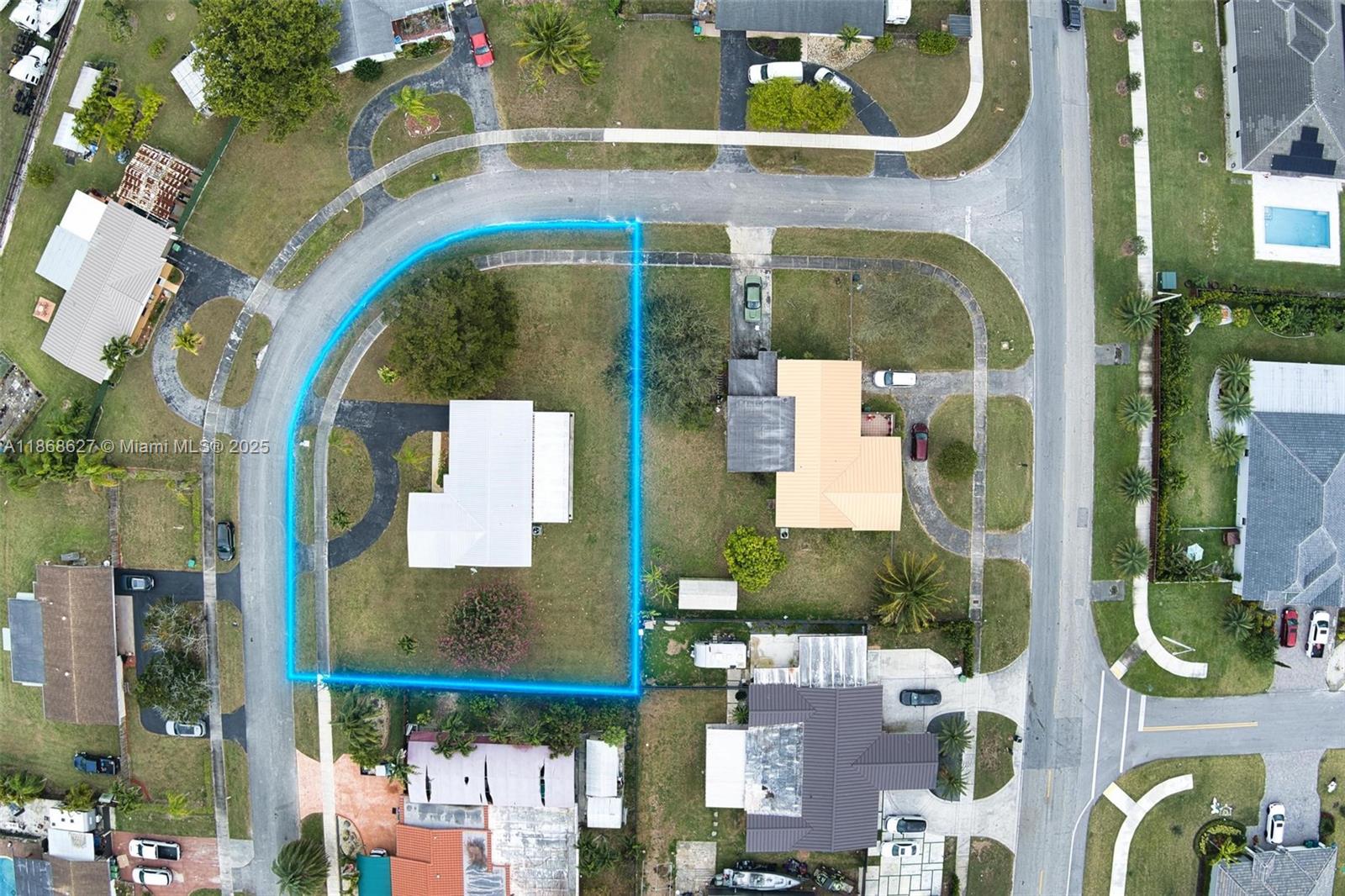 27661 Southwest 162nd Court Homestead, FL 33031 - Photo 49 of 60 an aerial view of a residential apartment building with a swimming pool
