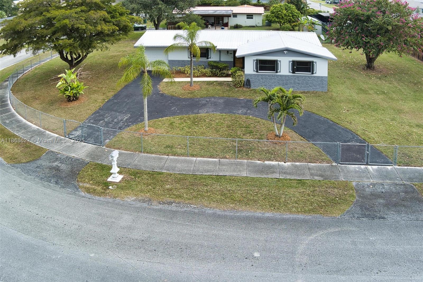 27661 Southwest 162nd Court Homestead, FL 33031 - Photo 55 of 60 a view of a house with a swimming pool