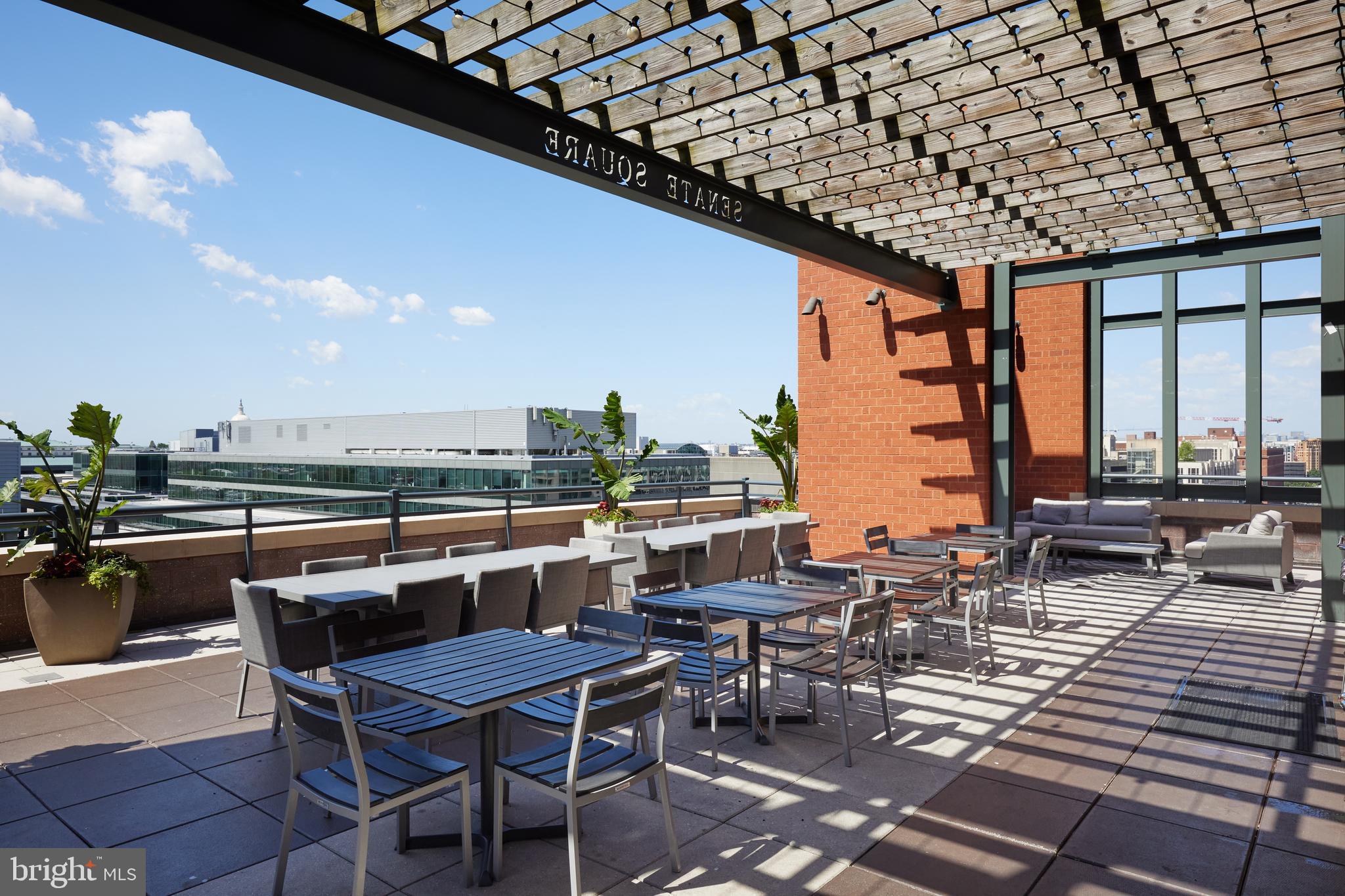 215 I Street Northeast, Unit 1B Washington, DC 20002 - Photo 53 of 78 Rooftop dining adjoining the pool
