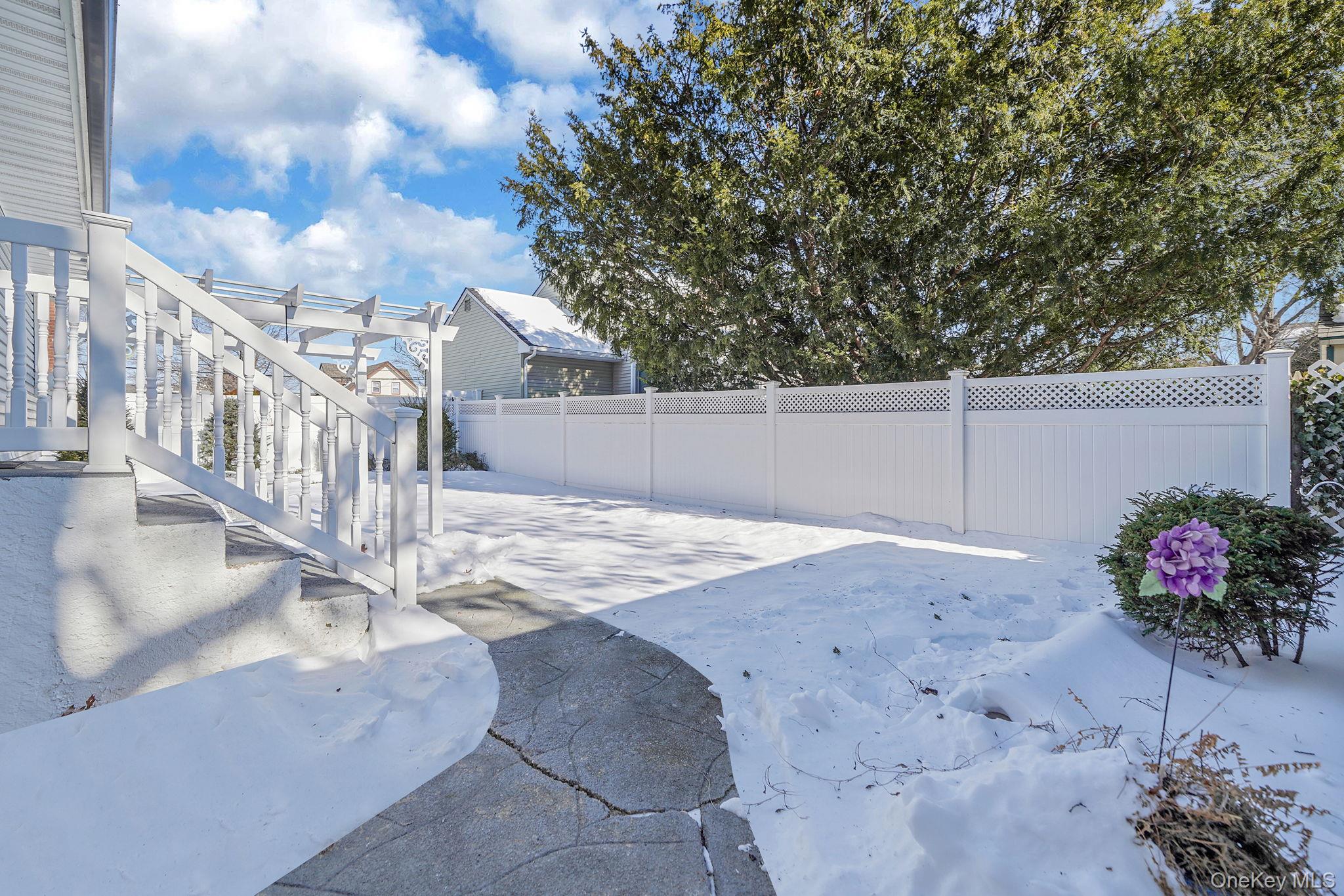 2009 Newbridge Road Bellmore, NY 11710 - Photo 5 of 24 a view of a backyard with a garden