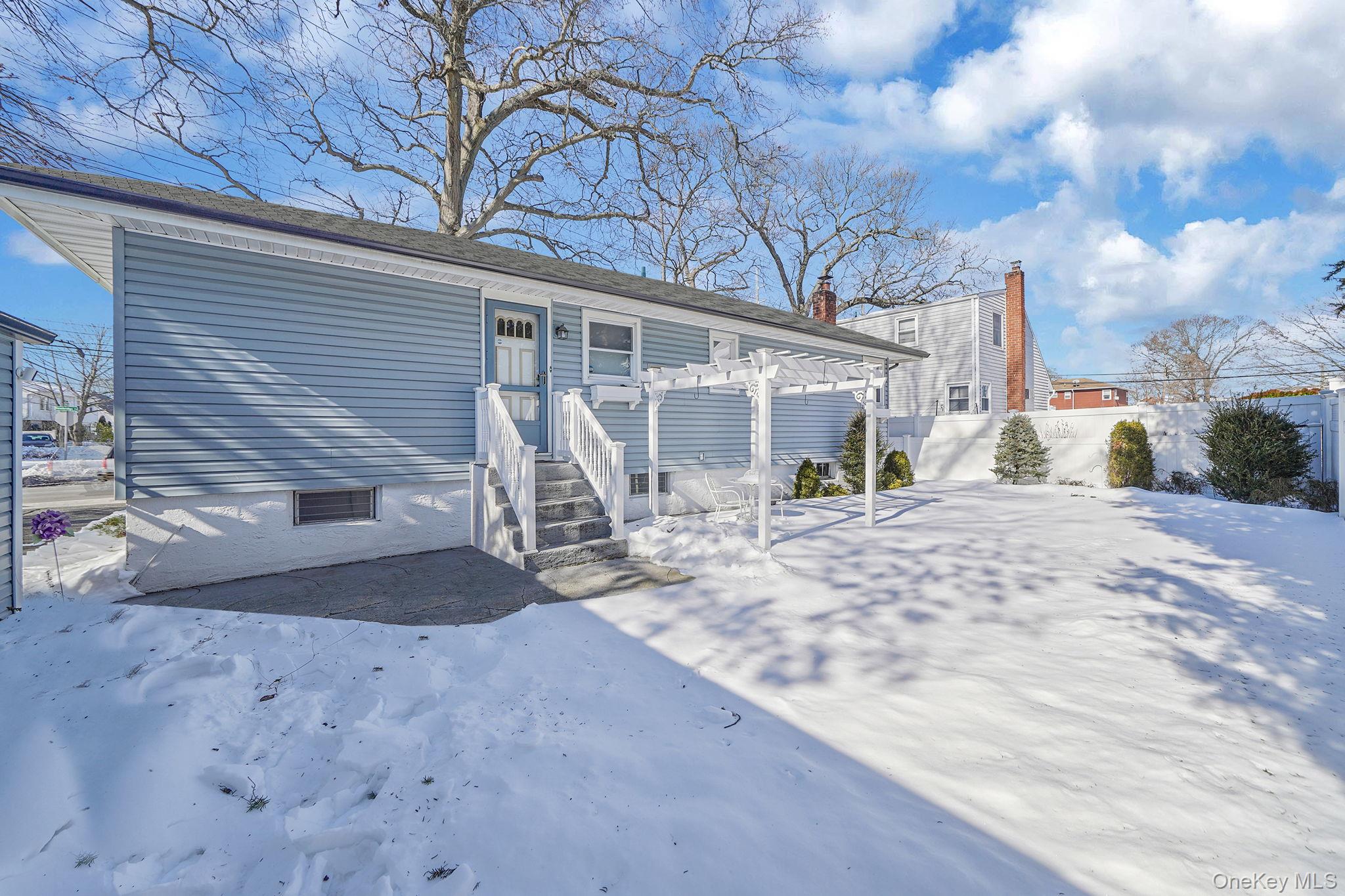 2009 Newbridge Road Bellmore, NY 11710 - Photo 7 of 24 a view of a house with a patio