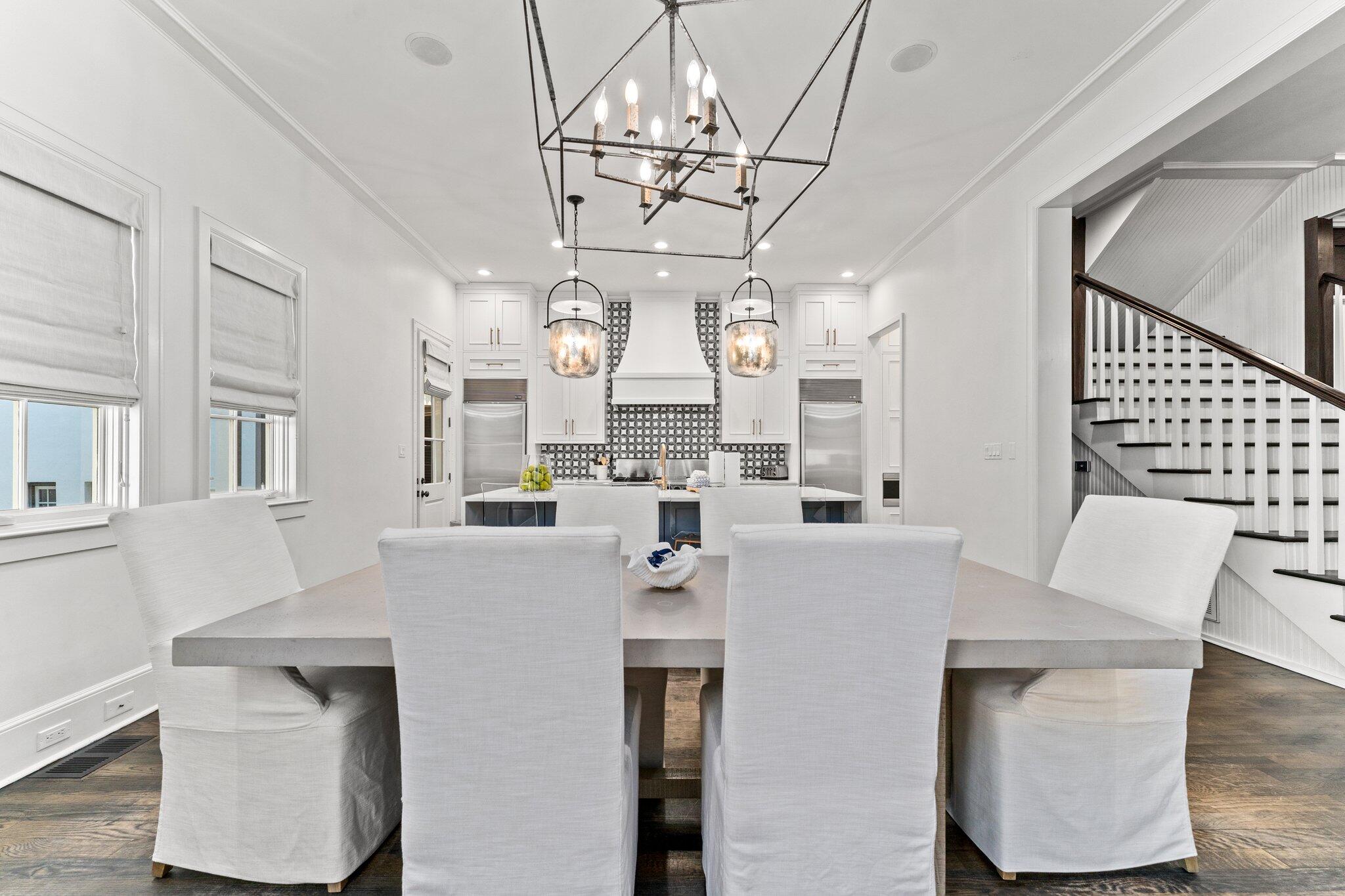 101 Round Road Rosemary Beach, FL 32461 - Photo 11 of 46 a large kitchen with a table chairs and a chandelier