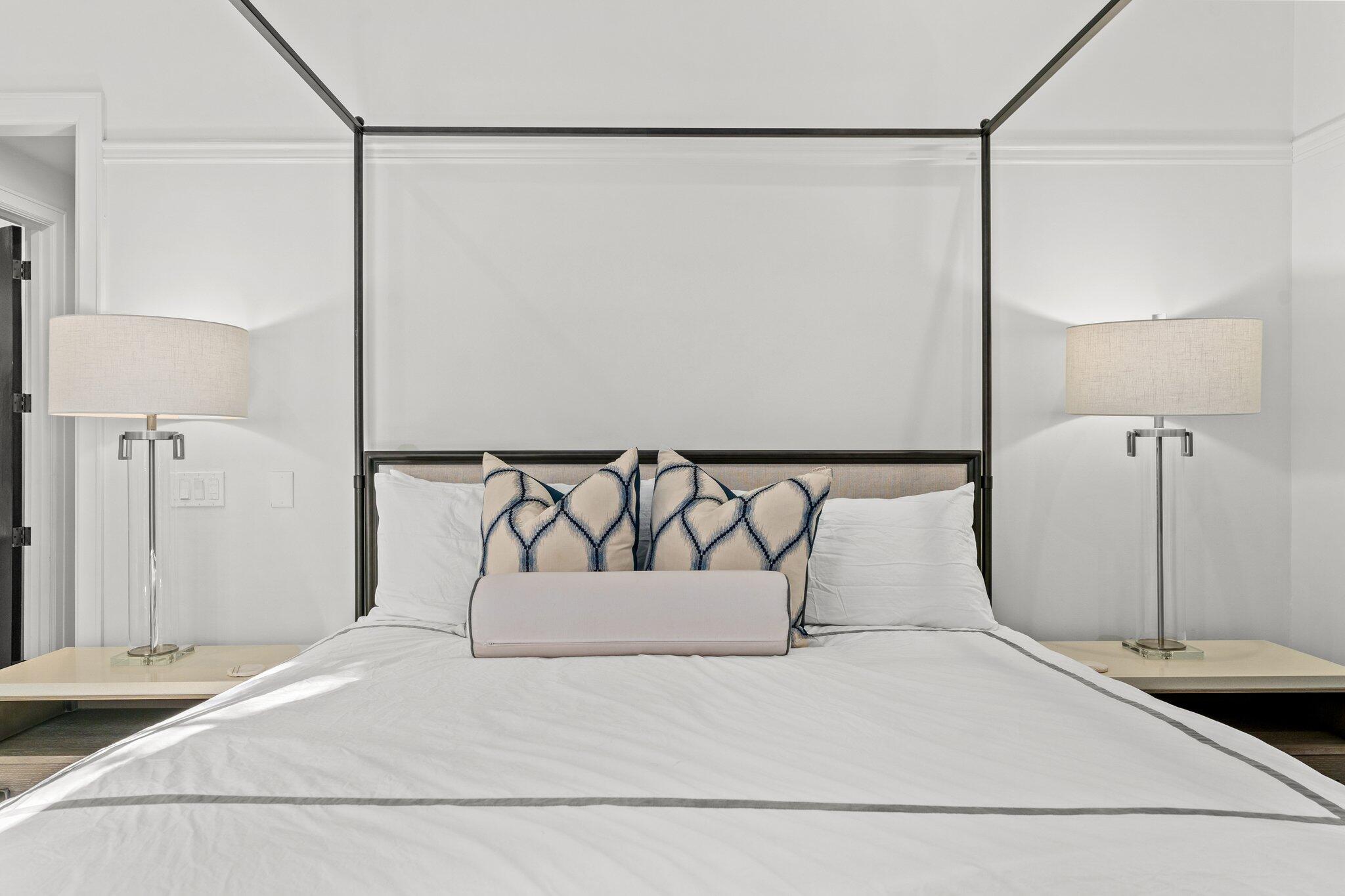 101 Round Road Rosemary Beach, FL 32461 - Photo 13 of 46 a bedroom with a bed and a night stand