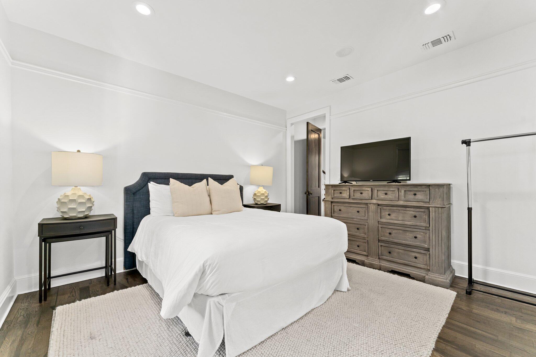 101 Round Road Rosemary Beach, FL 32461 - Photo 27 of 46 a bedroom with a bed and a flat screen tv