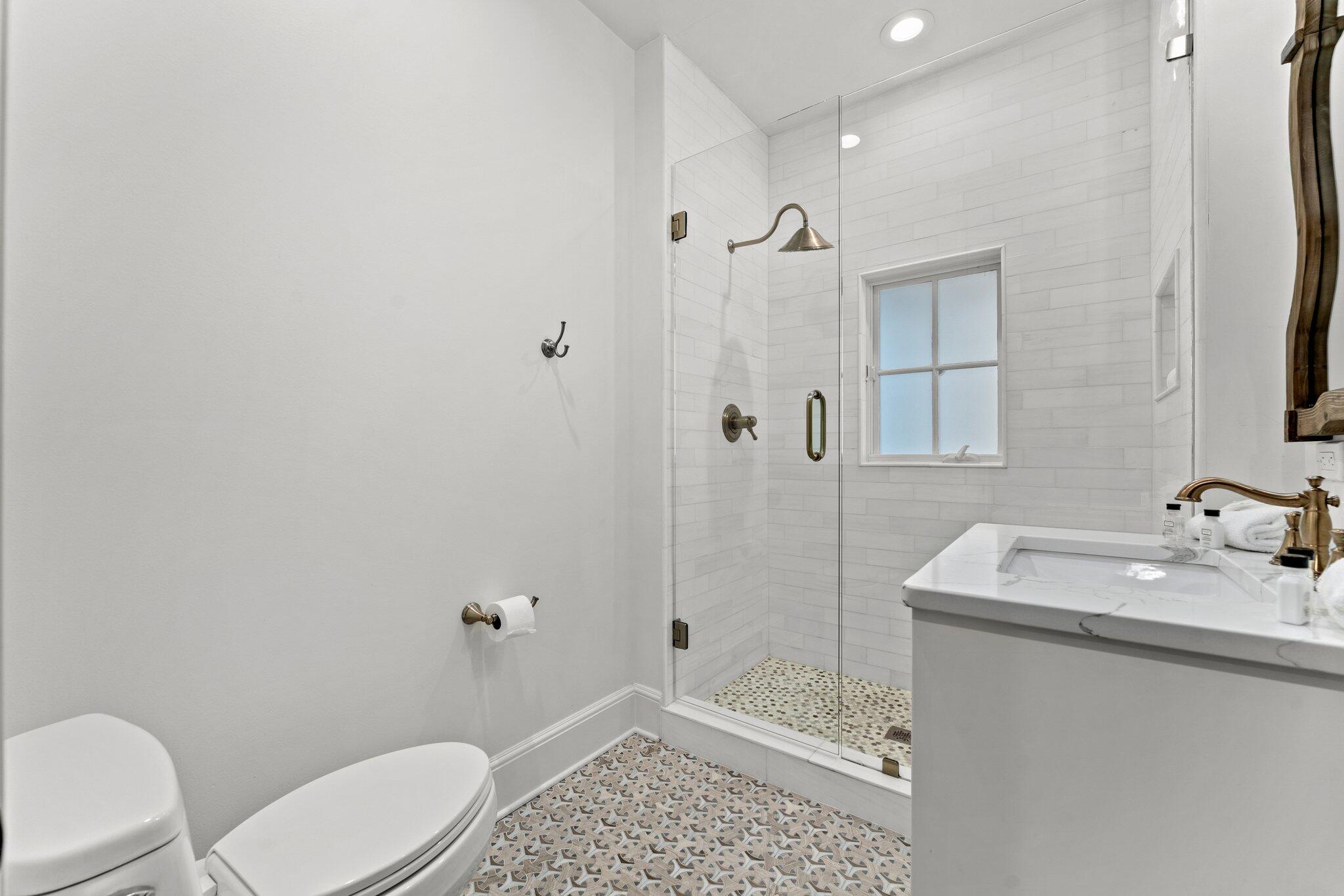 101 Round Road Rosemary Beach, FL 32461 - Photo 28 of 46 a bathroom with a sink a toilet and shower