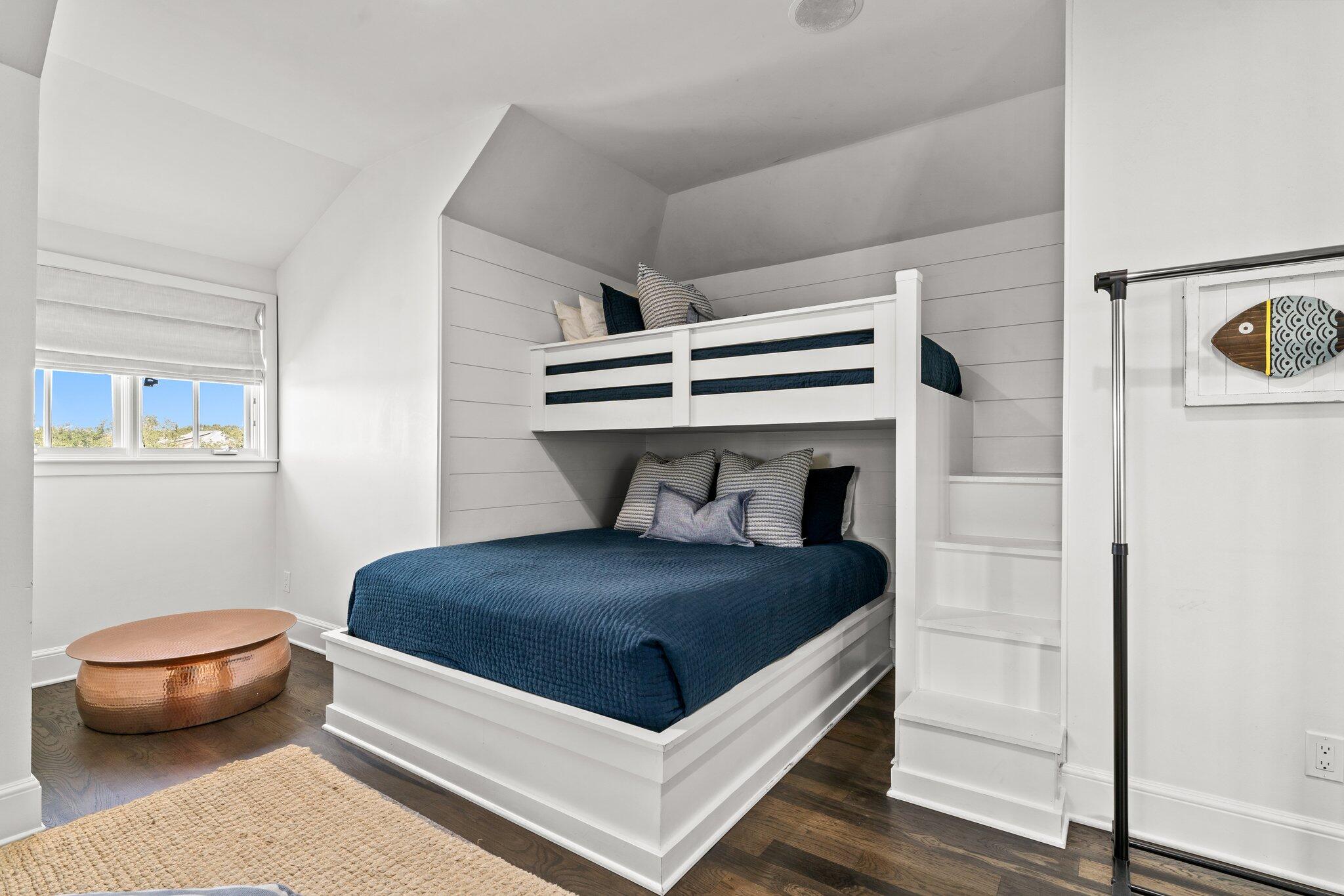 101 Round Road Rosemary Beach, FL 32461 - Photo 33 of 46 a bedroom with a bed and a chair