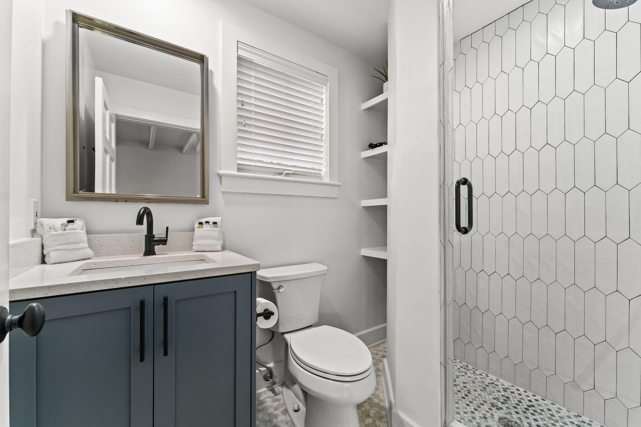 101 Round Road Rosemary Beach, FL 32461 - Photo 43 of 46 a bathroom with a granite countertop sink toilet and a mirror