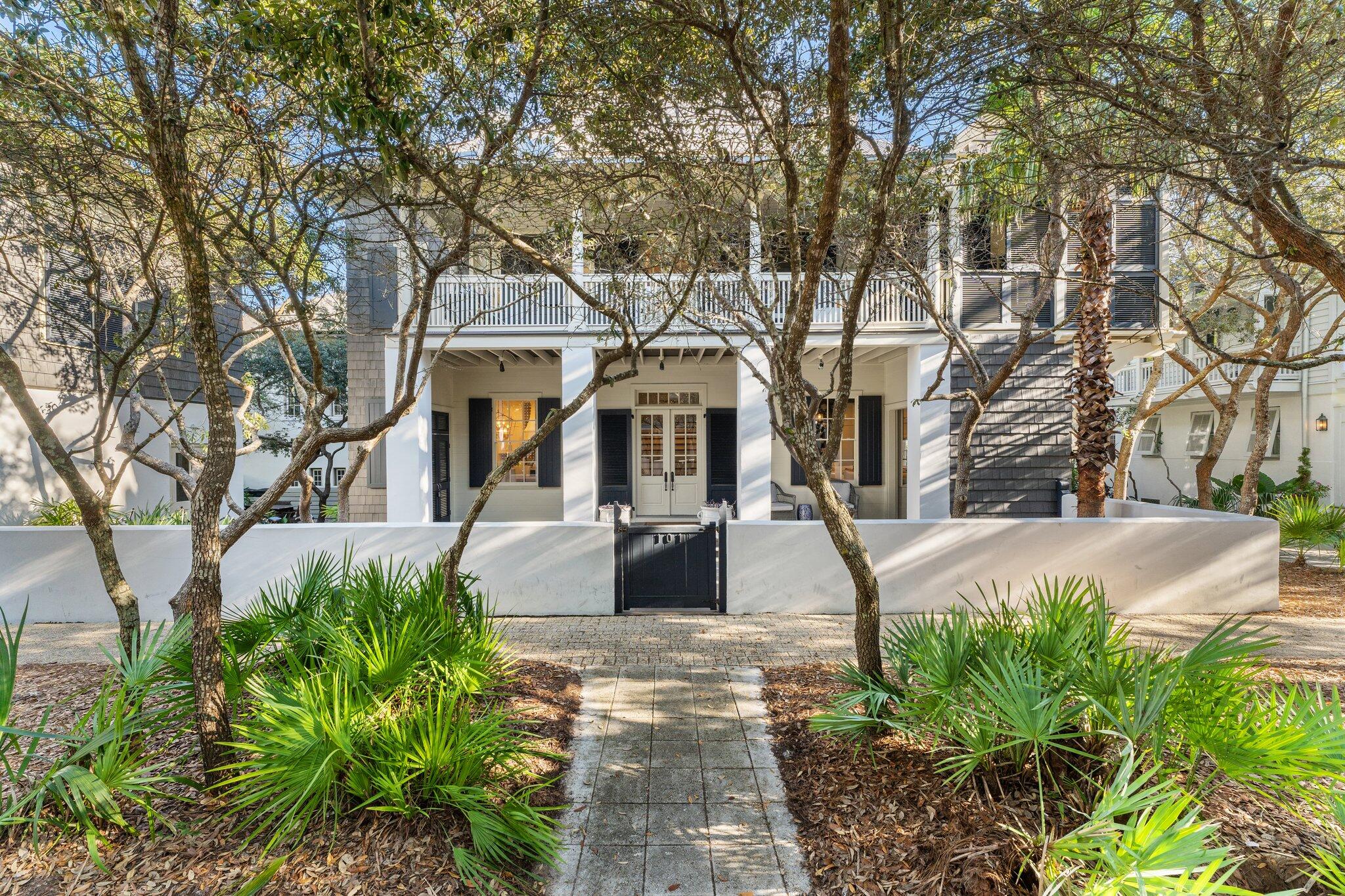 101 Round Road Rosemary Beach, FL 32461 - Photo 45 of 46 a front view of a house with a yard and potted plants