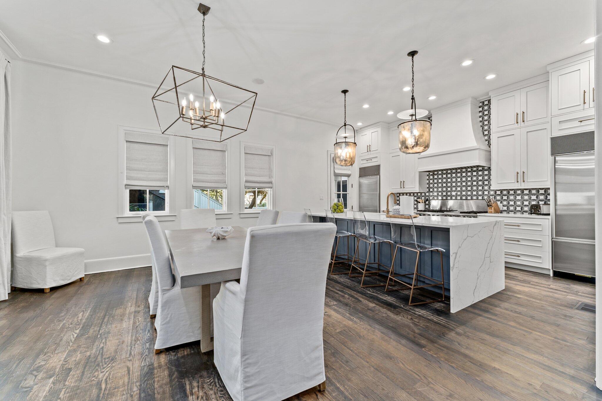 101 Round Road Rosemary Beach, FL 32461 - Photo 10 of 46 a view of a dining room with furniture wooden floor and chandelier