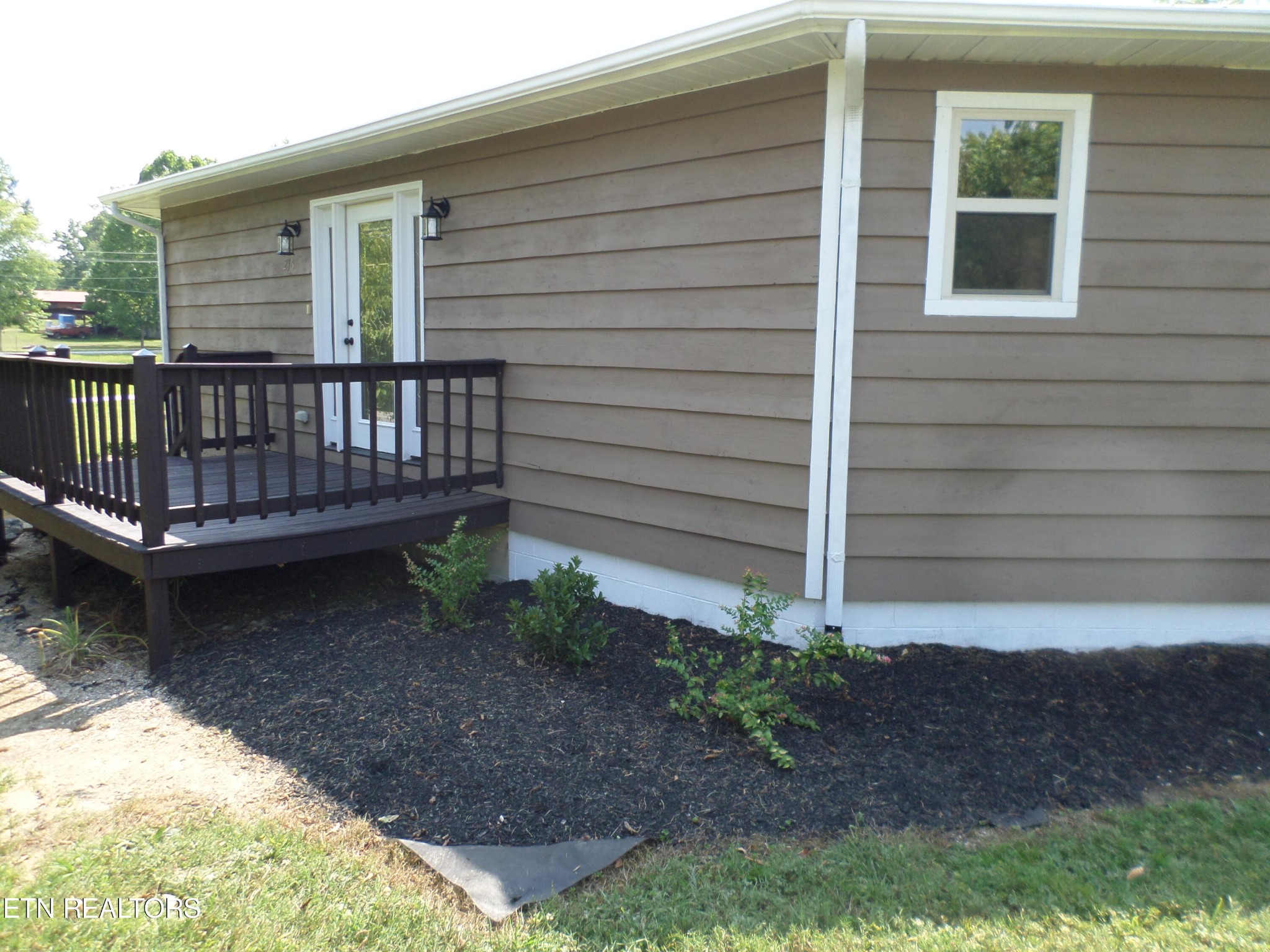 236 Woods Road Oliver Springs, TN 37840 - Photo 23 of 23 a view of a house with backyard and wooden fence