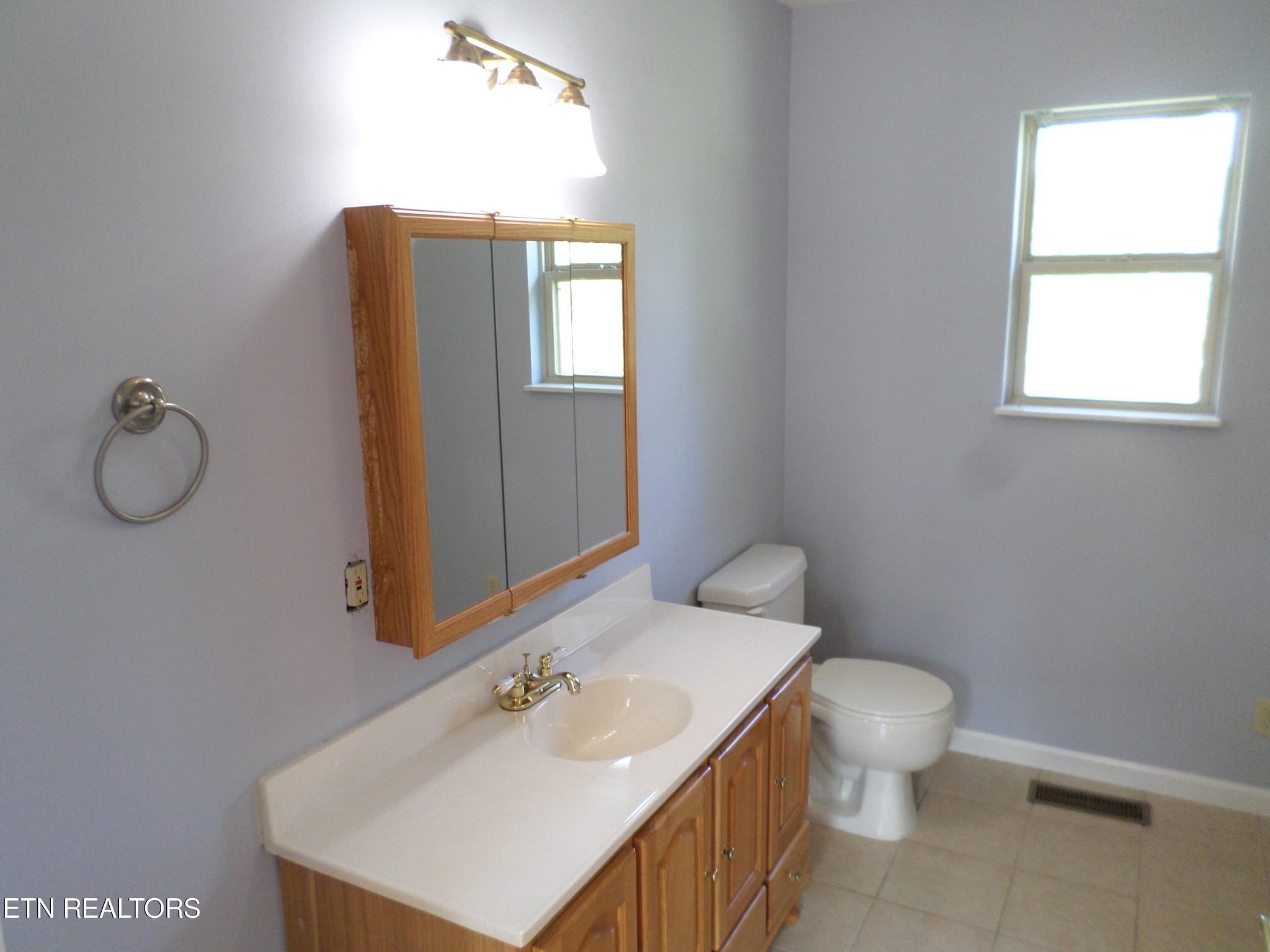 236 Woods Road Oliver Springs, TN 37840 - Photo 8 of 23 a bathroom with a toilet sink and mirror