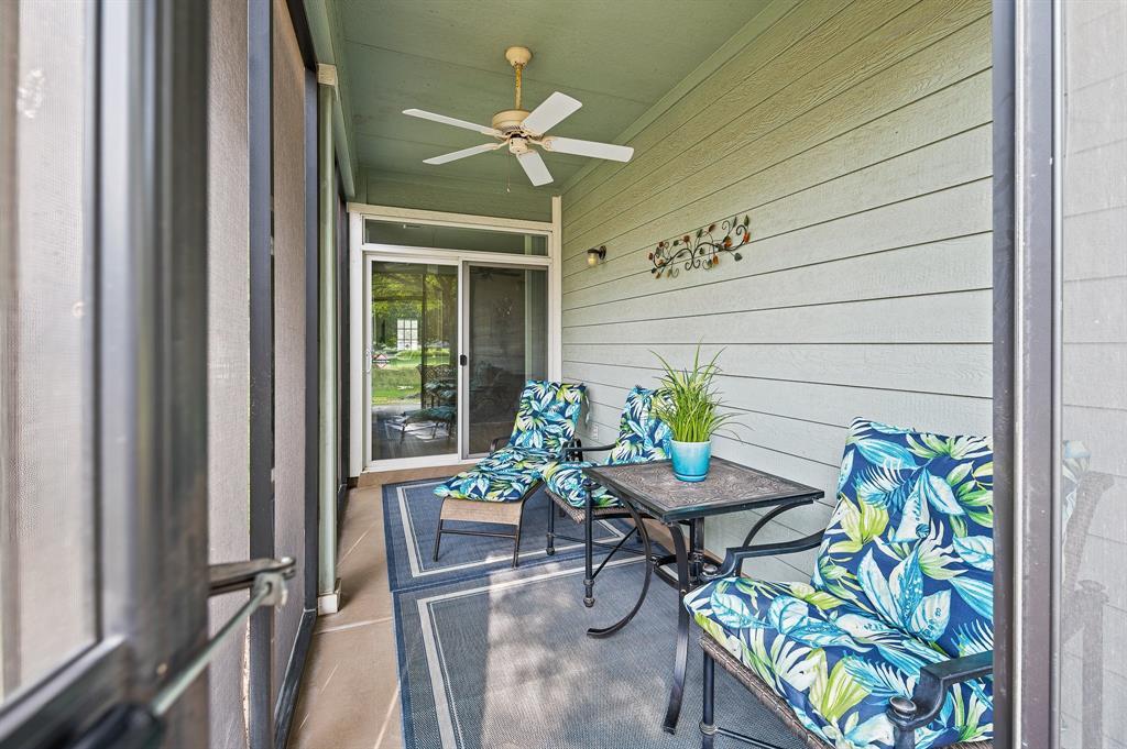 109 Providence Street Georgetown, TX 78633 - Photo 27 of 31 Screened patio featuring a ceiling fan, horizontal siding, and a sliding glass door