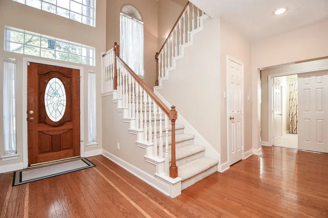 a view of entryway with wooden floor