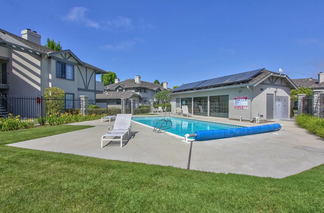 1051 Riker Street, Unit 7 Salinas, CA 93901 - Photo 1 of 1 a view of a house with a swimming pool and a yard