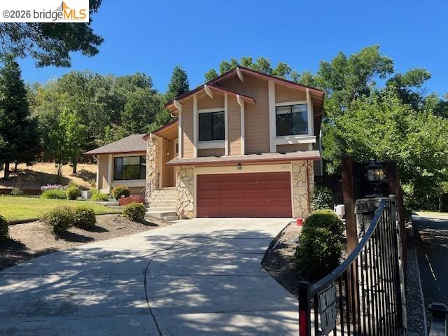 1445 Huston Road Walnut Creek, CA 94597 - Photo 1 of 12 a front view of a house with garden and parking