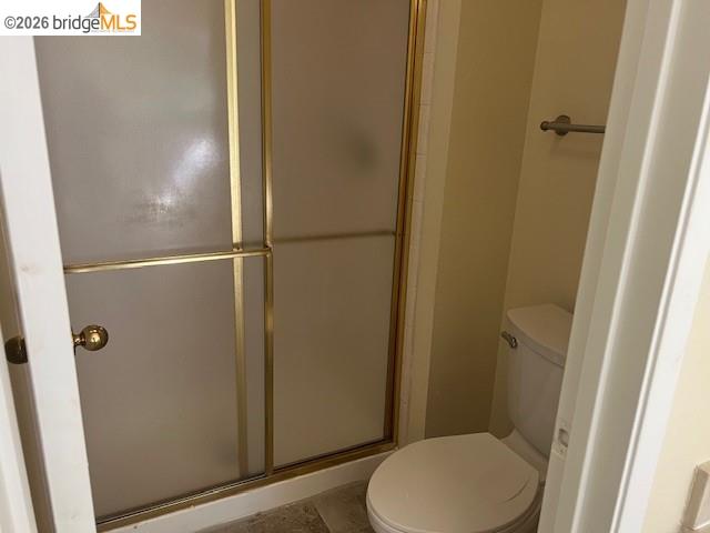 1445 Huston Road Walnut Creek, CA 94597 - Photo 11 of 12 a bathroom with a toilet and a shower