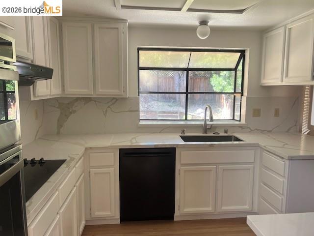 1445 Huston Road Walnut Creek, CA 94597 - Photo 7 of 12 a kitchen with a sink stove and cabinets