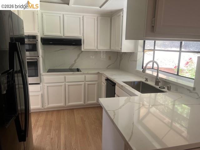 1445 Huston Road Walnut Creek, CA 94597 - Photo 8 of 12 a kitchen with a sink a stove and cabinets