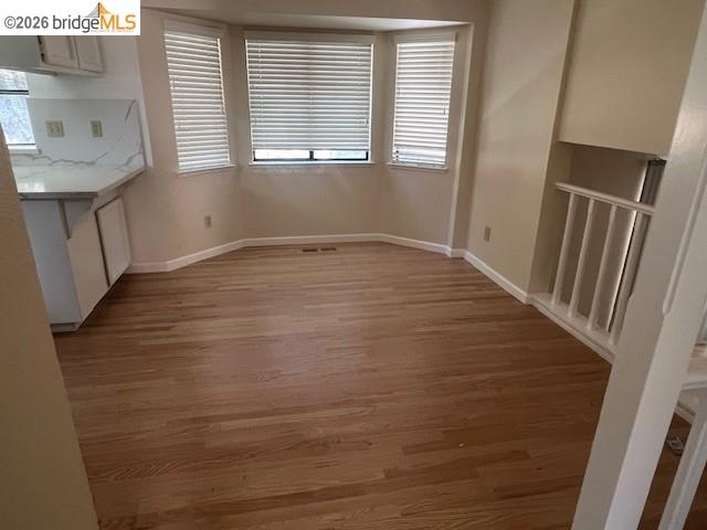 1445 Huston Road Walnut Creek, CA 94597 - Photo 8 of 12 a view of empty room with wooden floor and fan