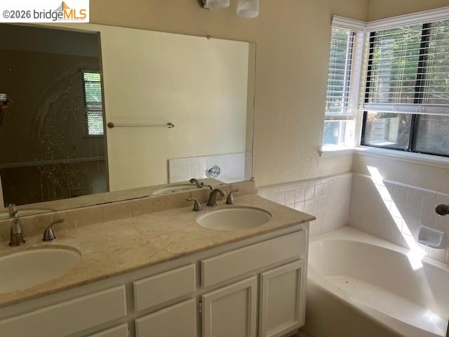 1445 Huston Road Walnut Creek, CA 94597 - Photo 10 of 12 a bathroom with a sink and a bathtub