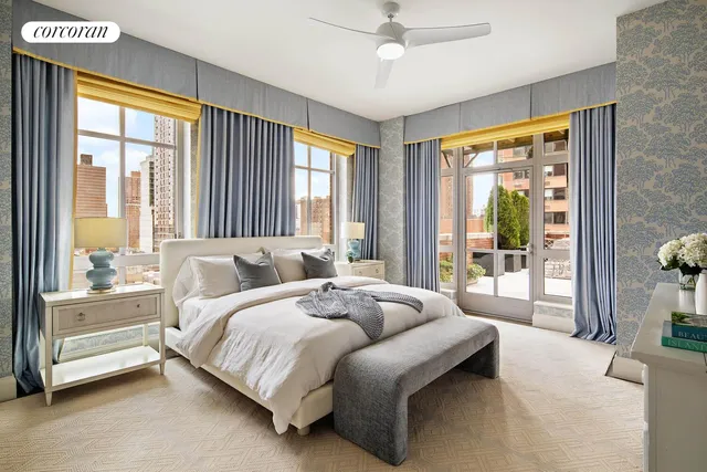 a living room with furniture and a floor to ceiling window