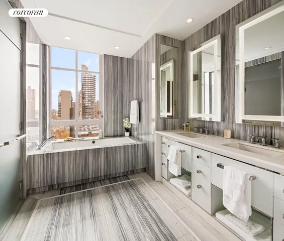 a spacious bedroom with a bed and a large window