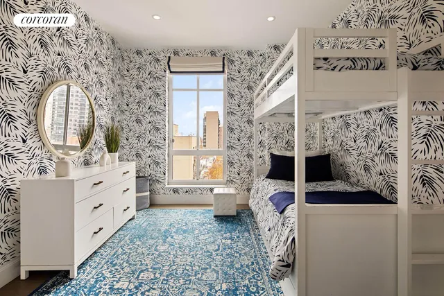 a large bathroom with double vanity and a large mirror