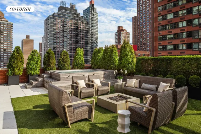a view of a patio with couches chairs and a potted plant