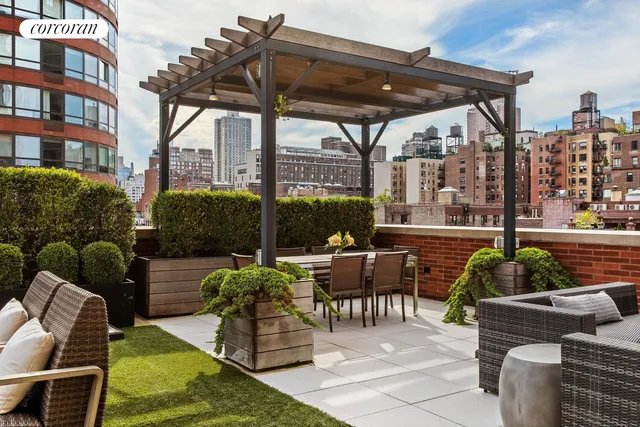 a view of a lake and couches in the patio