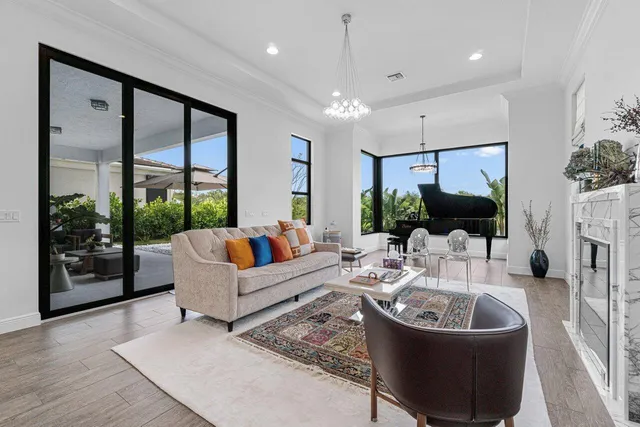 a view of a livingroom with furniture and a potted plant