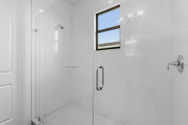 a view of a livingroom with chandelier furniture and windows