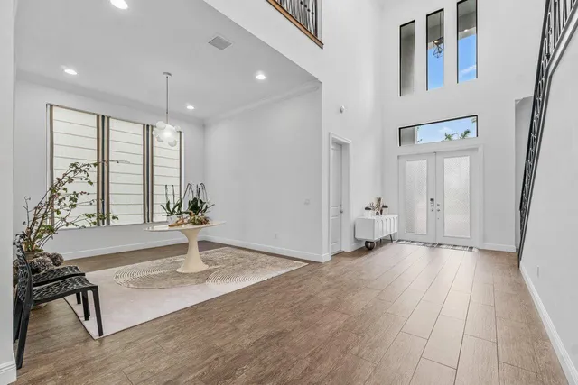 a view of staircase with wooden floor and a potted plant