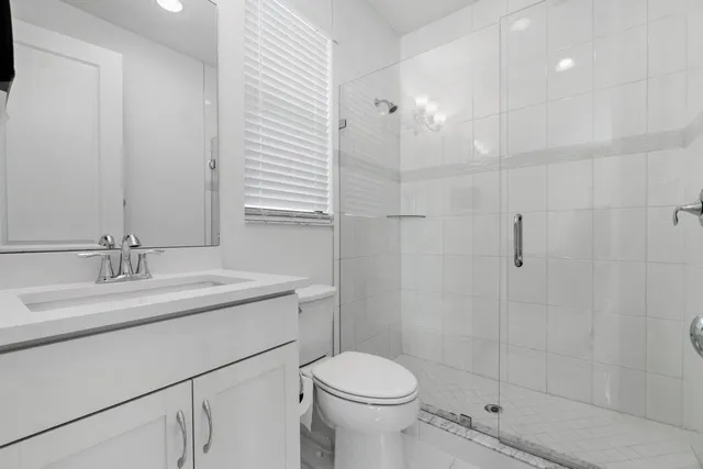 a view of a patio with a table and chairs under an umbrella