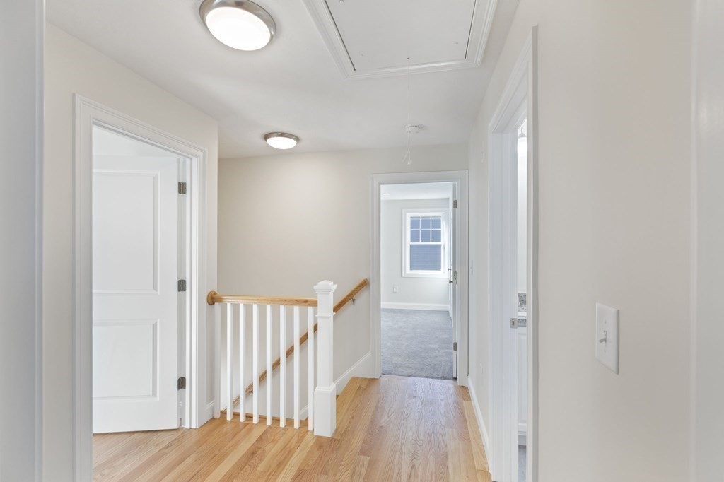 175 Rangeway Road Billerica, MA 01862 - Photo 8 of 18 a view of a hallway with wooden floor and entryway