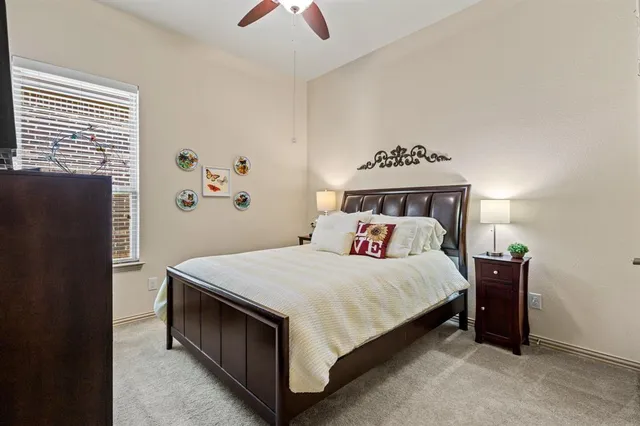 a bathroom with a granite countertop sink mirror vanity and toilet