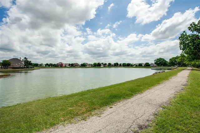 a view of swimming pool with outdoor seating and yard