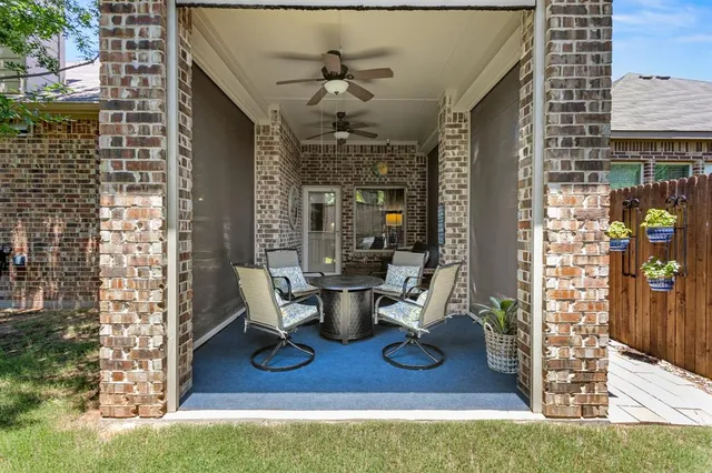 a view of living room with furniture and wooden floor