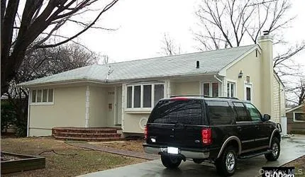 a car parked in front of a house
