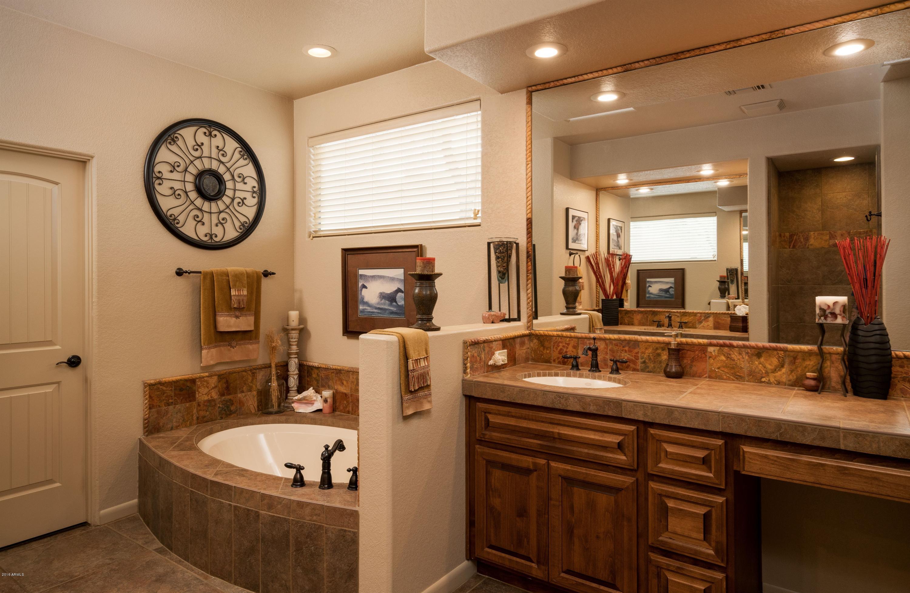 27913 North Quail Spring Road Rio Verde, AZ 85263 - Photo 15 of 63 a bathroom with a double vanity sink and a mirror