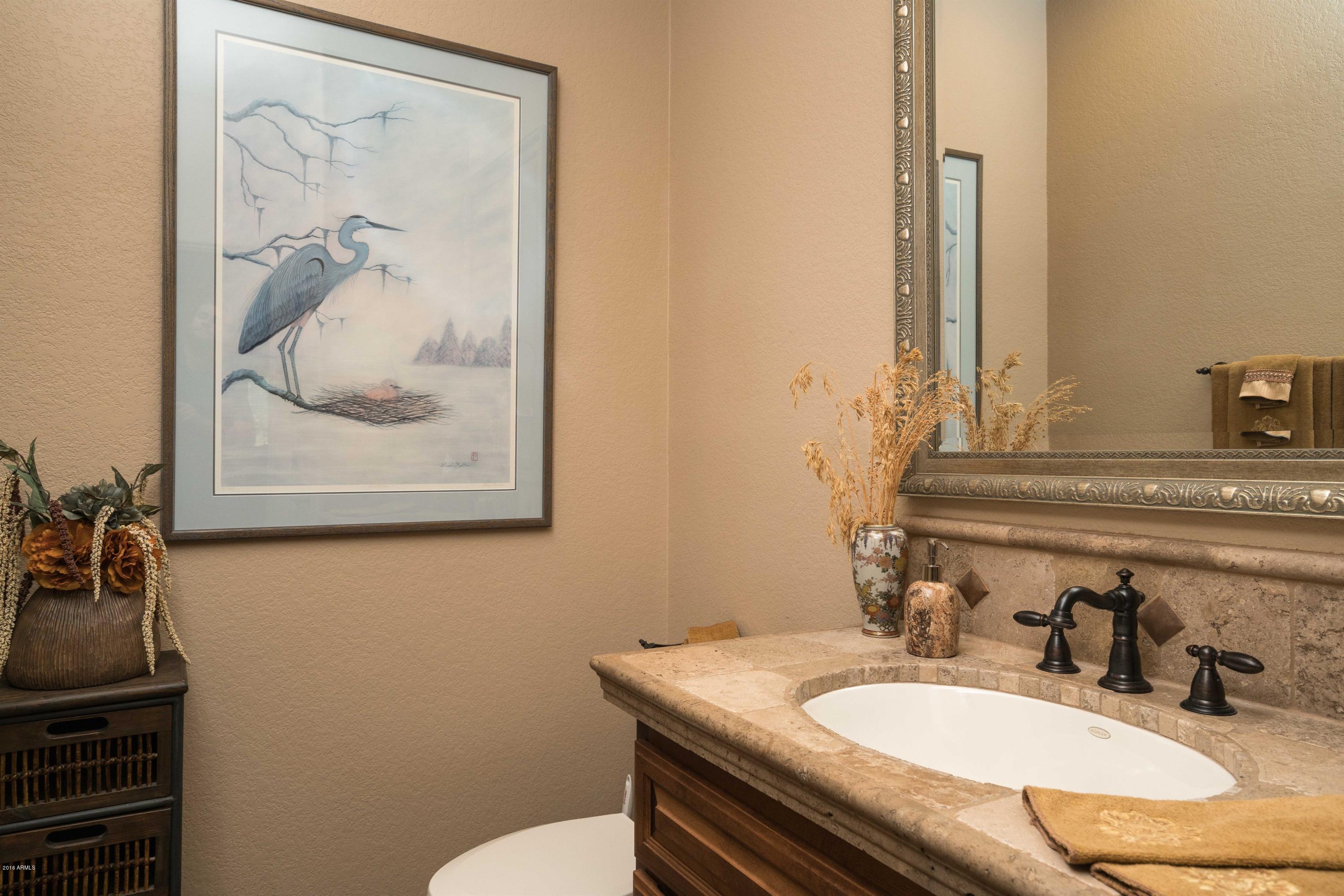 27913 North Quail Spring Road Rio Verde, AZ 85263 - Photo 18 of 63 a bathroom with a granite countertop sink and a mirror