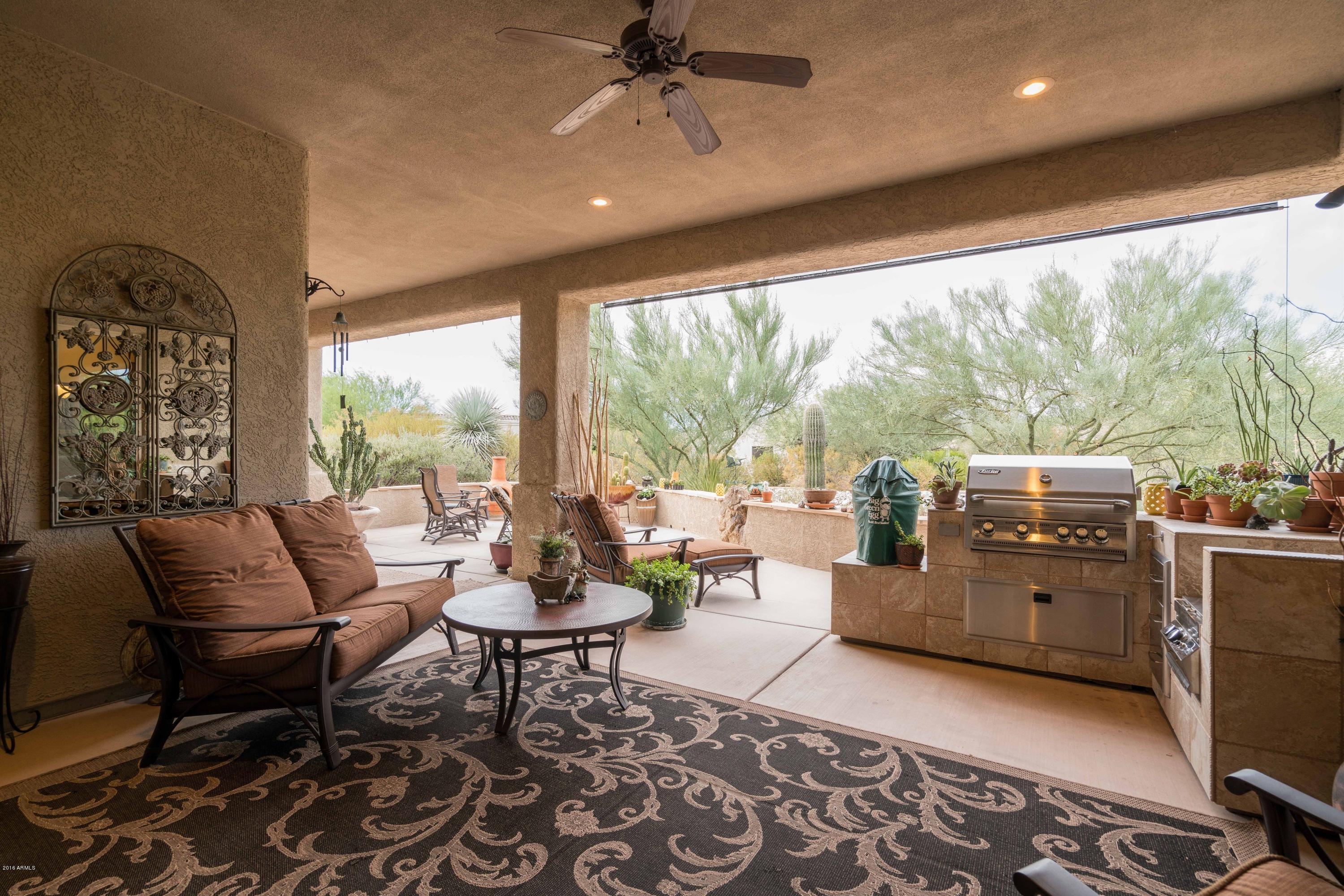27913 North Quail Spring Road Rio Verde, AZ 85263 - Photo 19 of 63 a living room with furniture and a large window